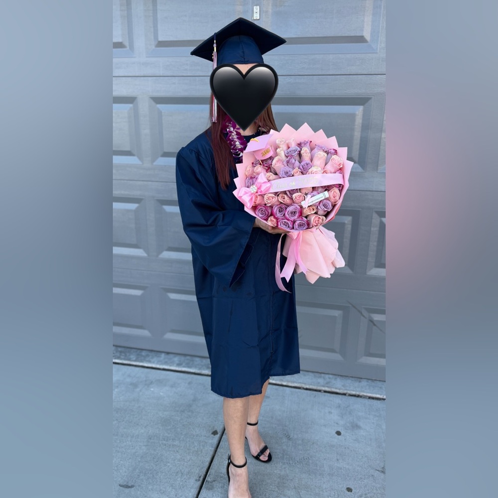 Graduation cap and gown with tassel and sash